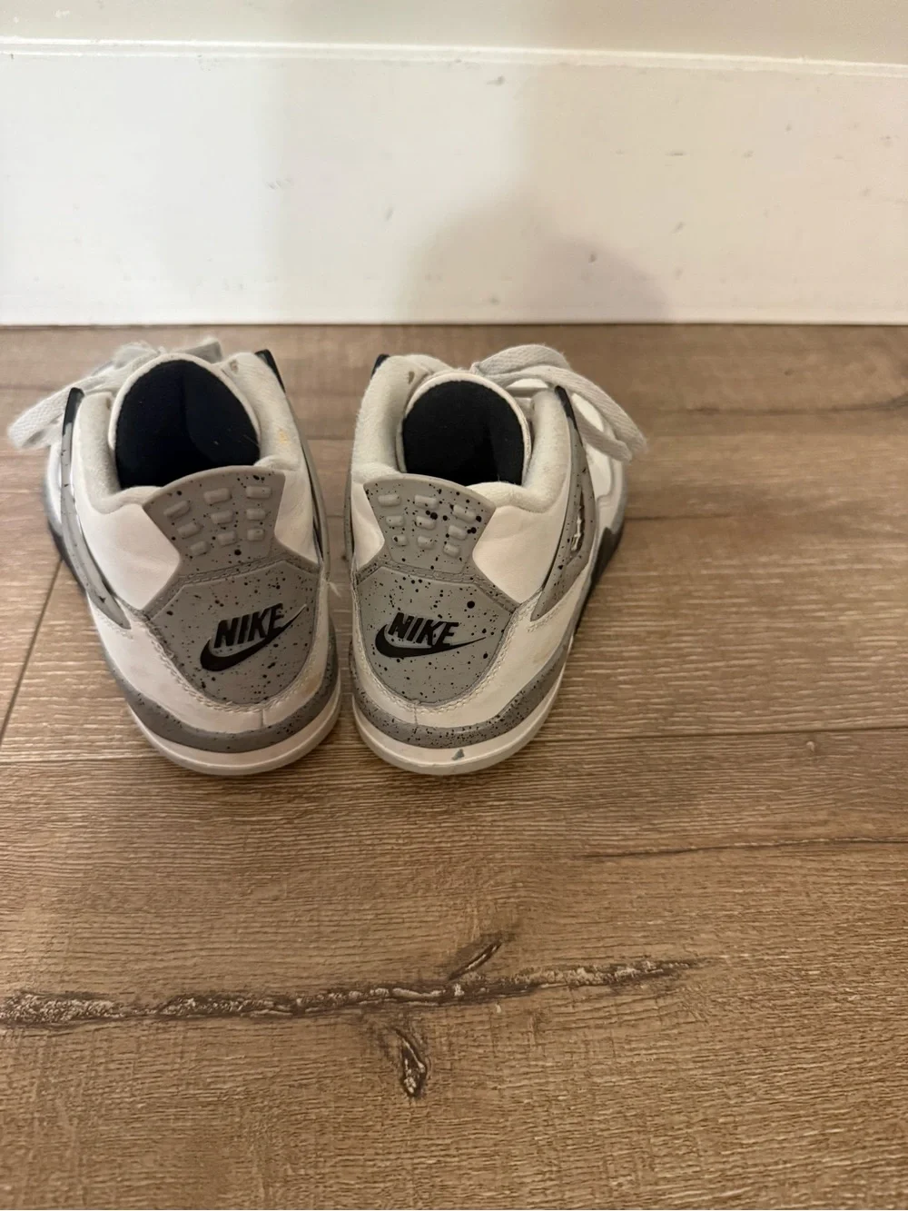Air Jordan 4 Retro “White Oreo” in kids size 1Y.